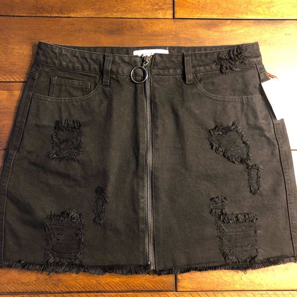Black distressed jean skirt.